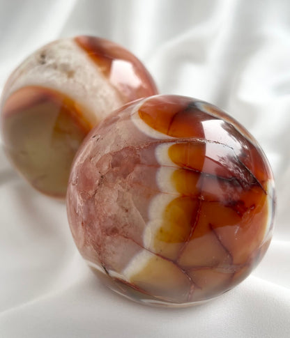 Natural Carnelian Sphere Carving with Quartz Inclusions